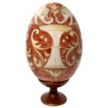 Ceramic egg hand painted with floral decorations. H Cm 33 with base