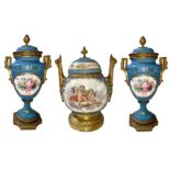 Triptych in ceramic and gilded bronze, Old France, XIX century. Pair of vases with central potiche