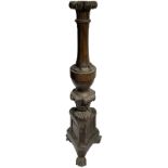 Candle stand in walnut wood, according to three lion's paws. XVIII century. H 161 Cm.