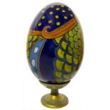 Ceramic egg hand painted with floral decorations. H Cm 33 with base.