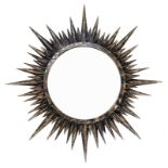 French production, in the style of Lene Vautrine. 1970s. Radiating mirror in lacquered and gilded