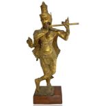 Origin Burma. Ancient statue in gilded bronze. Goddess Kal? with 4 arms playing the flute. H 76 cm