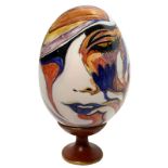 Ceramic egg hand painted with floral decorations. H Cm 33 with base.