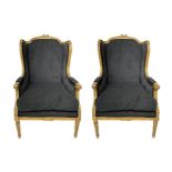 Pair of berg?re armchairs in gilted wood, XX century. Refurbished with gray cloth. Cm 107x57x56.