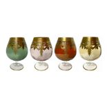 Four glasses made out of Murano glass , in four colors with border and gold decorations. H Cm 15.