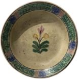 Majolica plate of Caltagirone, Sicily, early twentieth century. Decorated with a flower in shades