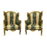 Two armchairs bergère in gilted wood, early XX century. Lined in beige and green color fabric. H