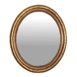 Oval Mirror, early twentieth century. In gildedwooden frame. Cm 118x100.