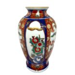 Porcelain vase. Decorated with flowers. 18 cm