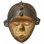 Kimbu ornamental terracotta mask, black pigments, brown and ocher. Mild fracture. Tanzania, the