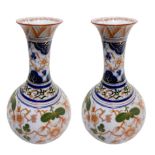 Pair of chinese porcelain vases with orange flower decoration on a white background, China. H 33 cm