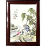 Chinese porcelain plate with fisherman scene with a child under a willow tree in the act of gift