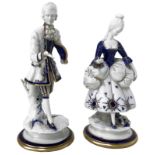 Pair of statues in porcelain by Capodimonte, lady and gentleman. H Cm 24- 23. Pieces missing on the