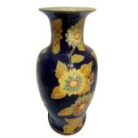 Majolica vase decorated with sunflowers on a blue background. H 53 cm