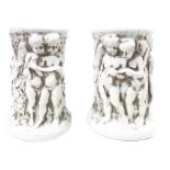 Pair of porcelain vases by Capodimonte, decorated with white cherubs. H Cm 11