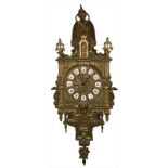 Wall clock, XX Century, France. In gilded bronze, with porcelain numbers. H 60X18 cm. With key.