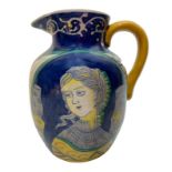 Pitcher Umbrian polychrome majolica, early 900. With double medallion woman face. yellow handle. H