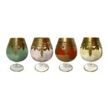 Four glasses from Murano glass for cognac, in four colors with border and gold decorations. H 15 Cm.