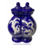 Double chinese vase, blue with relief decoration on both sides with dragons in white, with lid.