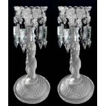 Pair of glass candlesticks, 19th century. With Louis Philippe toasts and base depicting a naked