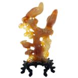 Chinese statuette carnelian, light brown and transparent, depicting three birds of paradise on a