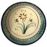 Bowl majolica of Caltagirone, XX century. In colors of green with floral decorations. Diameter 29