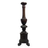 Candlestick in walnut wood, according to three lion's paws. XVII century. H 161 Cm.