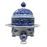 Tripod Censer in blue and white porcelain, China XIX-XX centuries, the base decorated with floral