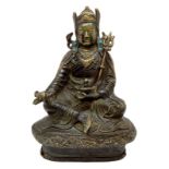 Sculpture in bronze Padmsambhava, depicted in a sitting position holding the vajra in his right