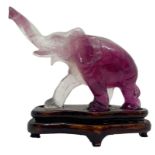 Chinese statuette depicting transparent amethyst walking elephant. Beijing. Early 1900s. Cm H 7. H