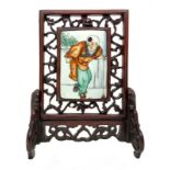 Chinese porcelain plaque depicting children, China, eighteenth century. Set in a carved wooden