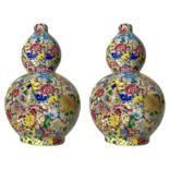 Couple of small chinese double-gourd vases finely decorated in the style of "a thousand flowers".