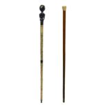 Two walking sticks. Nineteenth century. H 90 cm.