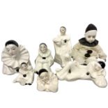 Seven white porcelain figurines depicting "Piero"