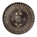 Ethiopian parade shield , nineteenth century. In leather hardened upturned edge decorated with