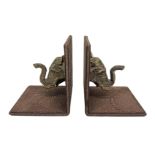 Pair of leather bookends with elephant head in gilded bronze, XX century. H cm 13.