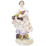 Meissen porcelain statuette, early twentieth century. Woman with grapes basket, H cm 23, Base cm 10.