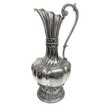 Important silver pitcher, early twentieth secolo.Con handle, lobed body and embossed. H cm 41.