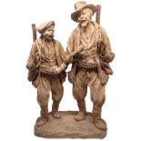 Terracotta figurine depicting monochrome couple of hunters with rifles. H cm 35. Signed and dated