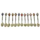 12 teaspoons in silver 800 , with enamels representing emblems of Italian cities. H 11.5 cm