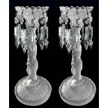 Pair of glass candlesticks, 19th century. With Louis Philippe toasts and base depicting a naked
