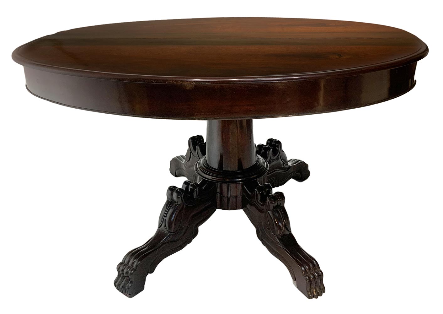 Extending oval dining table in rosewood. Four-spoke foot with lion carving, late 19th century. H cm