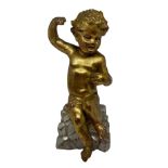Golden wooden statue depicting "puttino" sitting on a silver-plated wooden base, early twentieth