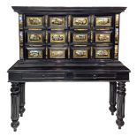 Coin Cabinet in black ebonized wooden, two-body structure, eighteenth century. 12 paintend glass