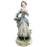 Capodimonte porcelain small statue depicting lady with a basket of flowers, twentieth century. H cm