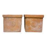 Pair of square terracotta vase with rosettes on all four sides, mid-twentieth century. H 37 cm,