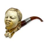 Pipe "African character" - Vienna, Austria. Late 1800s. The tobacco chamber and the shank of the