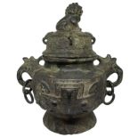 Bronze ritual vase, China. Two-handled with lid surmounted by lion, H 32 cm, width 30 cm, depth 20