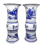 A pair of trumpet vases in blue white Chinese ceramics "Gu" depicting landscape. XVIII century.