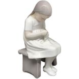 Figurine depicting child who sews, B & G Bing & Grondal, Denmark. H 20 cm